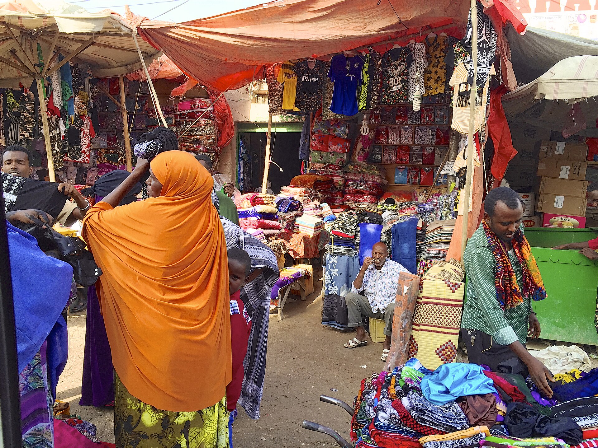 Traders selling textiles and goods at a busy street market in Hargeisa, Horn of Africa
